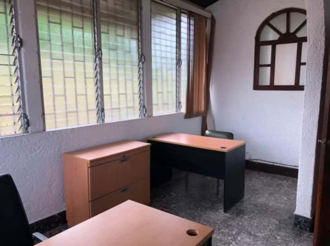 Smaller office unit with tile floors window and traditional decor in Perejil Panama