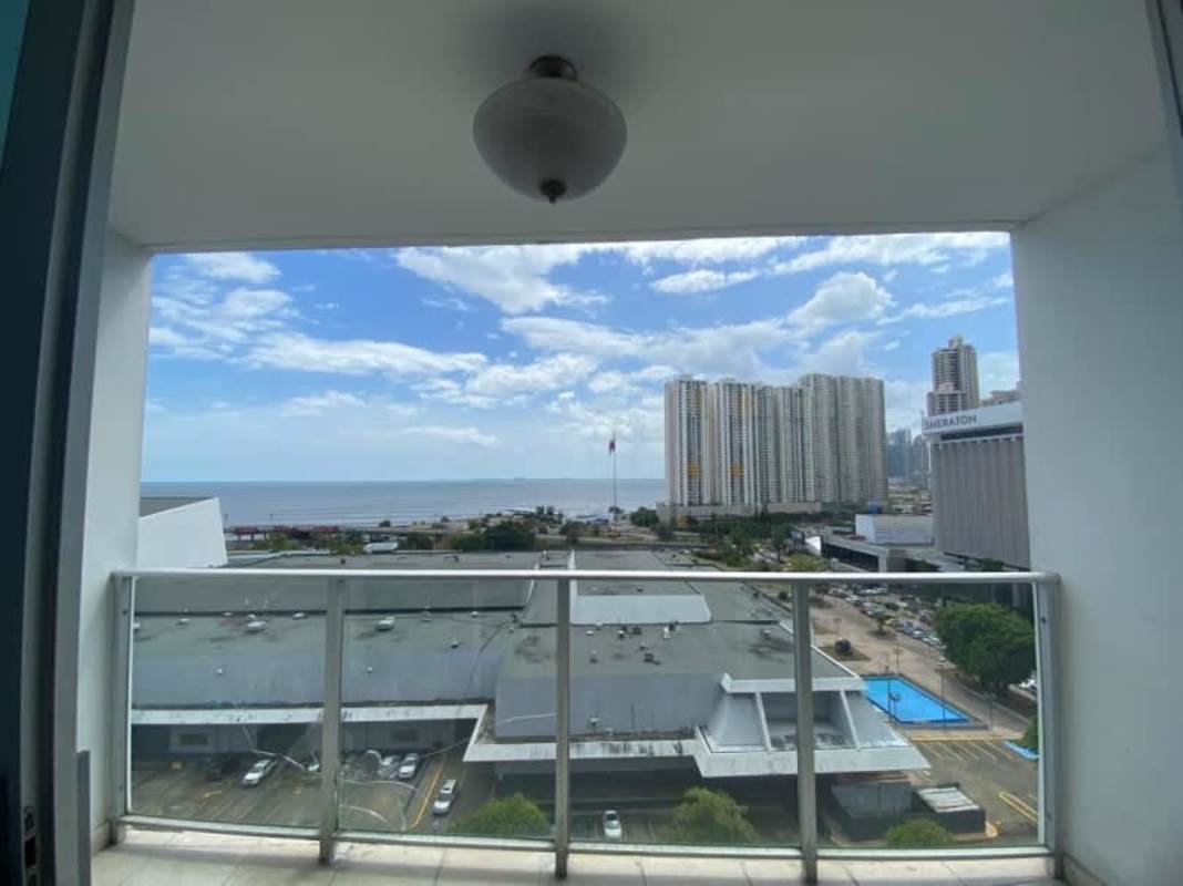 Balcony with glass railing overlooking Panama Bay and city skyline in PH Titanium San Francisco Panama