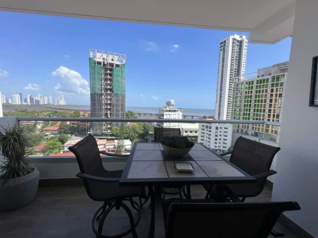 Contemporary bedroom large windows en-suite bath ocean city views PH Panorama Panama