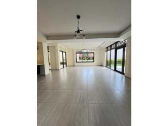 Spacious open kitchen with breakfast countertop, appliances, in PH Nativa Panama Pacifico