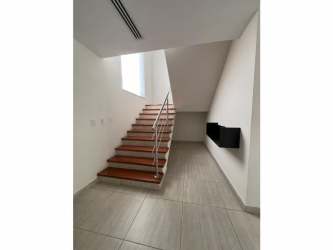 Spacious covered patio and tropical landscaped garden for outdoor dining in PH Nativa