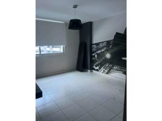 Modern bathroom with mosaic wall, vanity sink, mirror and window in PH Miró condo El Cangrejo Panama