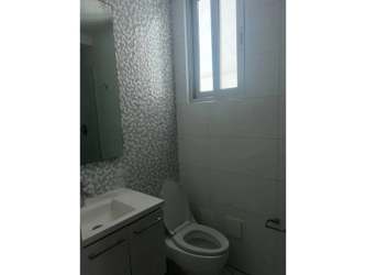 Bedroom with tiled floor, large window, Eiffel Tower wall mural in PH Miró El Cangrejo Panama City