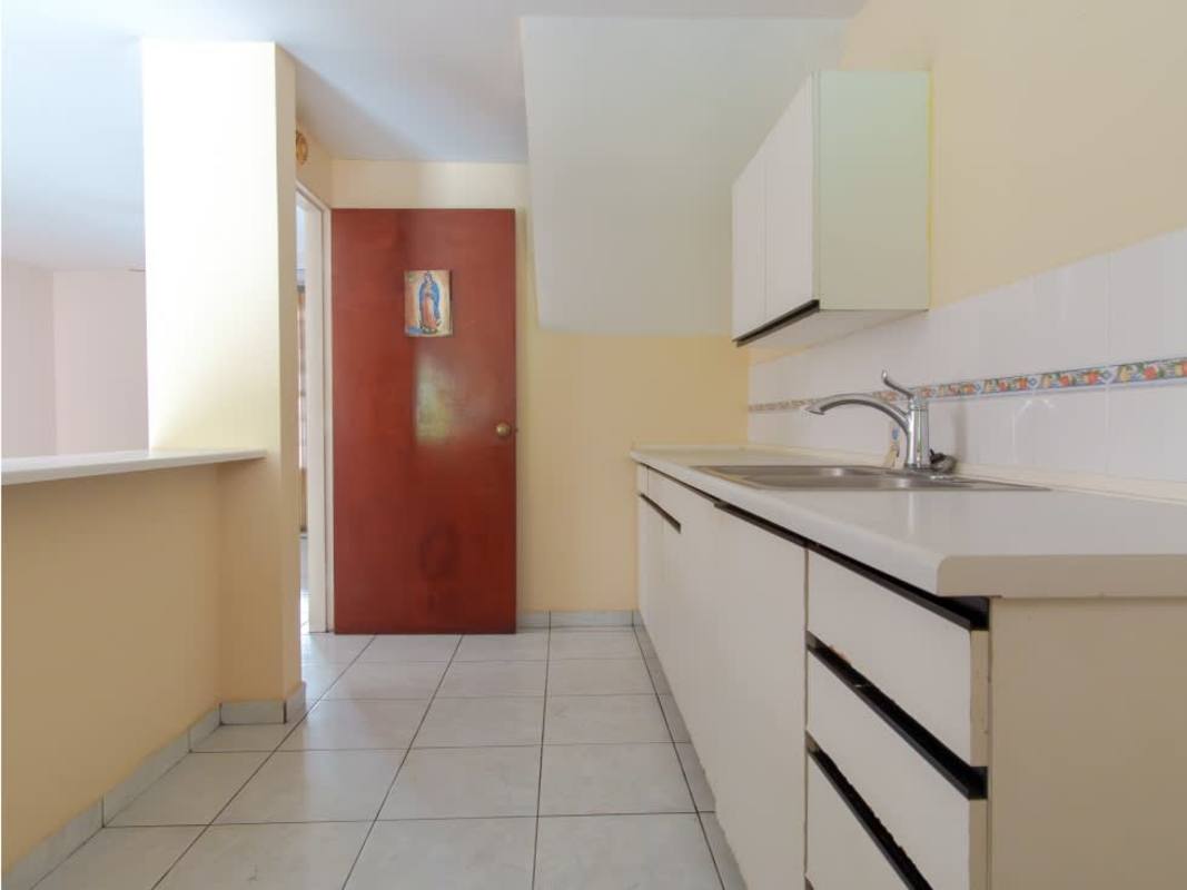 Traditional kitchen with tile backsplash, security door and breakfast bar in foreclosure house Condado del Rey Panama