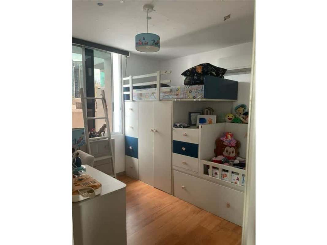 Covered outdoor terrace with playground, artificial turf, dining area and skyline view PH Cangrejo 507 Panama