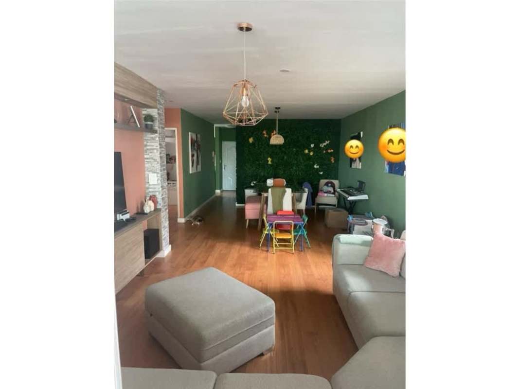 Living dining area open plan with green accent wall in PH Cangrejo 507 El Cangrejo Panama