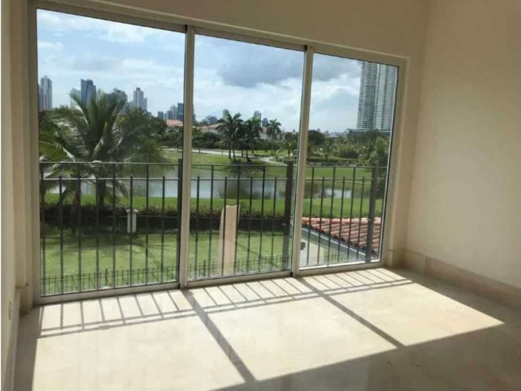 Modern living room with panoramic glass doors balcony golf skyline view PH The Reserve Panama