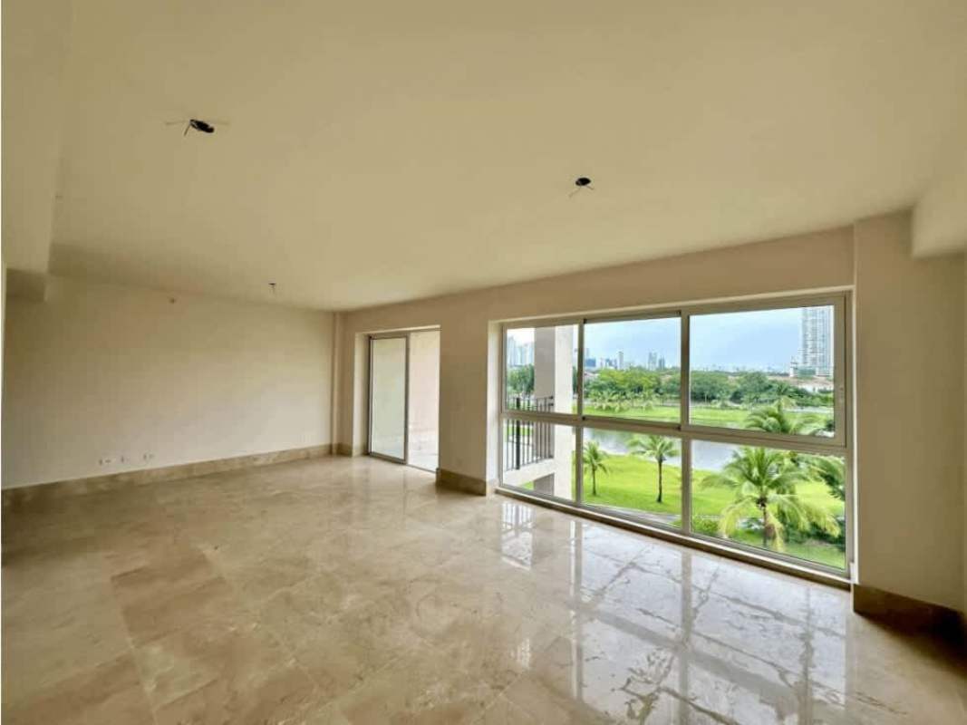 Large minimal living room with marble floors balconies skyline view PH The Reserve