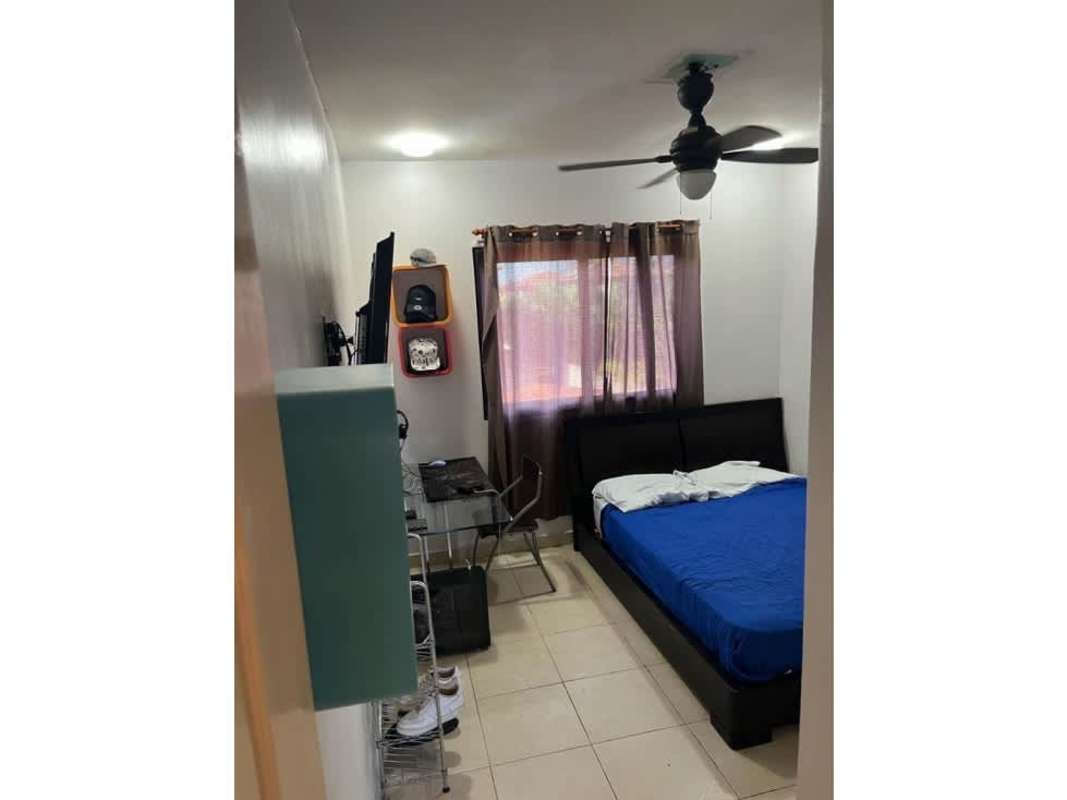 Modern kitchen with granite counters, wood cabinets, dining area in Versalles Panama