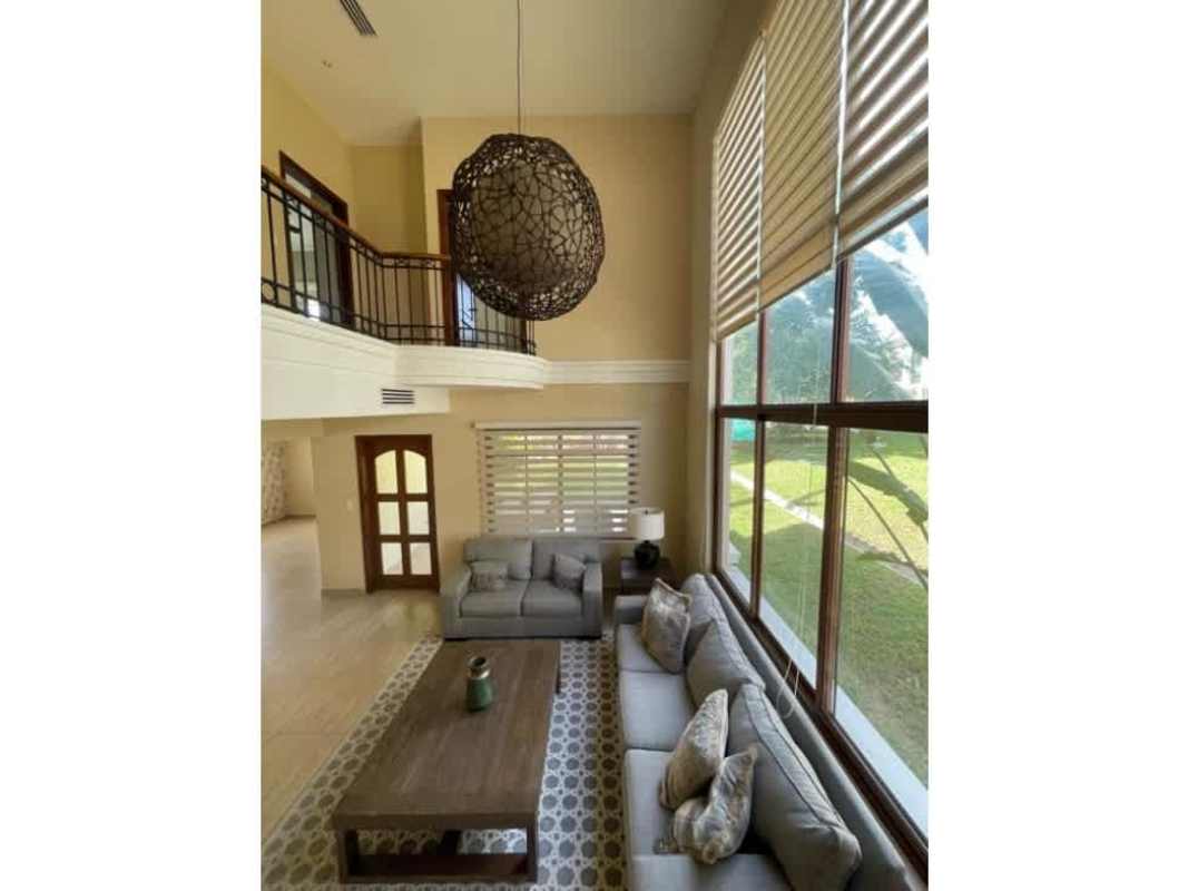 Large living room with double height windows in Los Senderos Clayton Panama home for sale