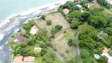 Aerial panorama of oceanfront lots, beach access, greenery, Gorgona Panama