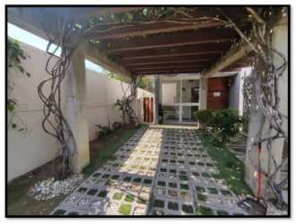 Minimalist bedroom with floor-to-ceiling windows wooden blinds built-in closet PH Villa Iguana