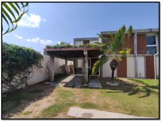 Modern house exterior covered patio garden lawn climbing plants PH Villa Iguana San José