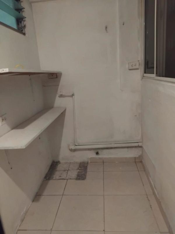 Utility laundry space with shelves and window affordable Panama Villa de las Fuentes rental