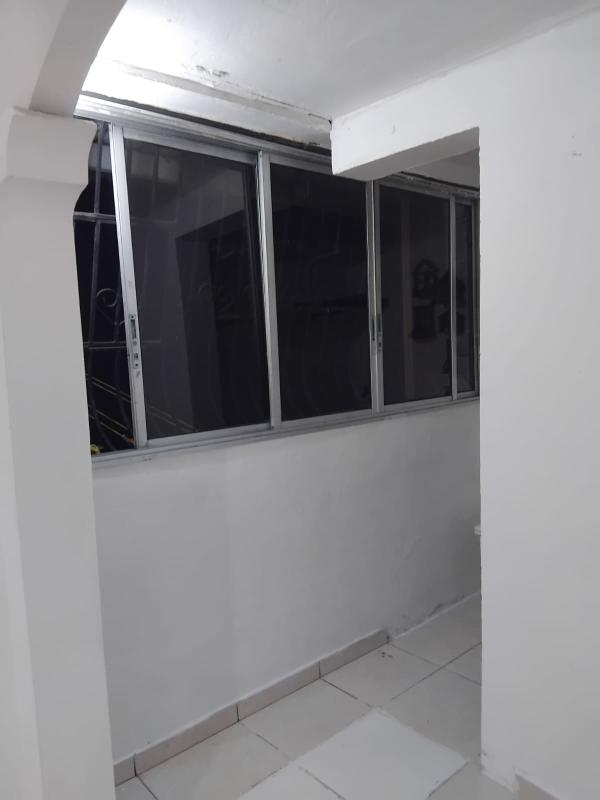 Basic laundry and utility space with sink and birdhouse decor Villa de las Fuentes rental apartment