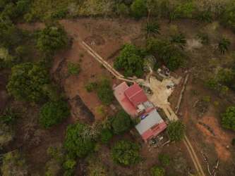 Rustic farmhouse with red roof, outbuildings and open surrounding land Vista Bella Arraiján Panama