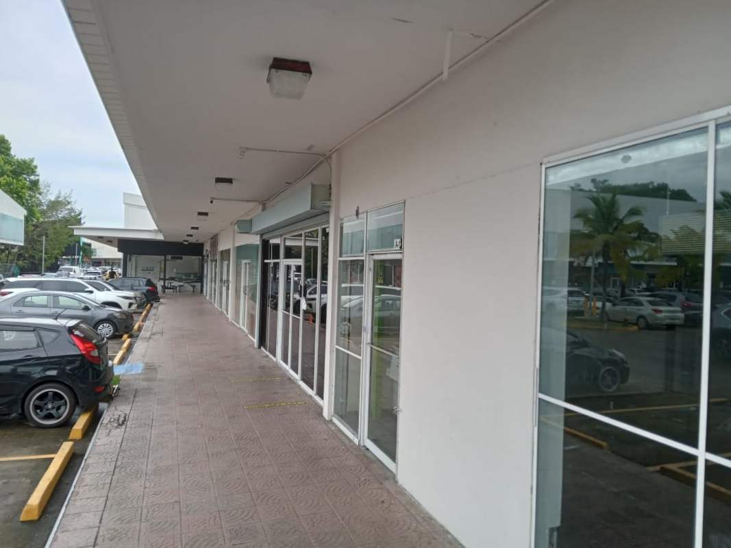 Street-facing glass storefront commercial unit at Los Pueblos Shopping Center Panama City