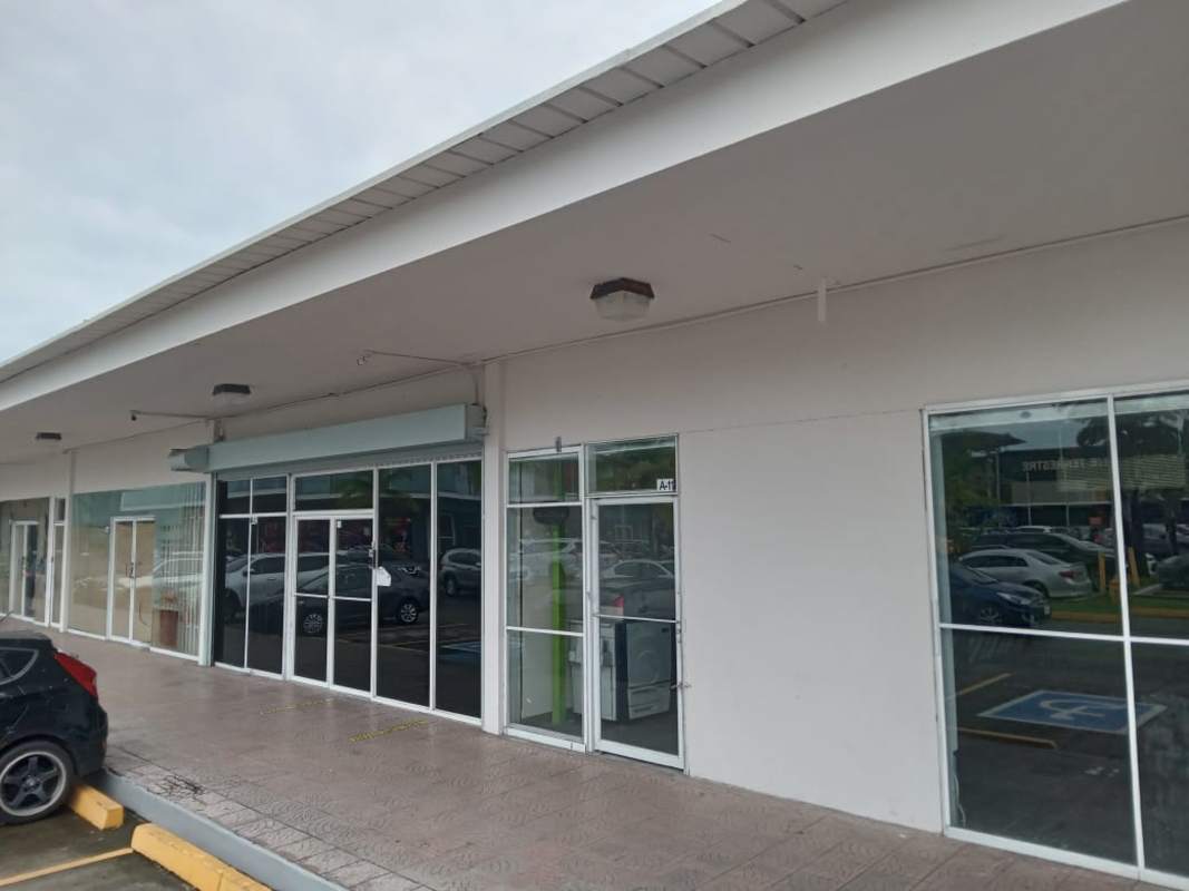 Commercial unit with modern glass facade and canopy walkway Los Pueblos Panama