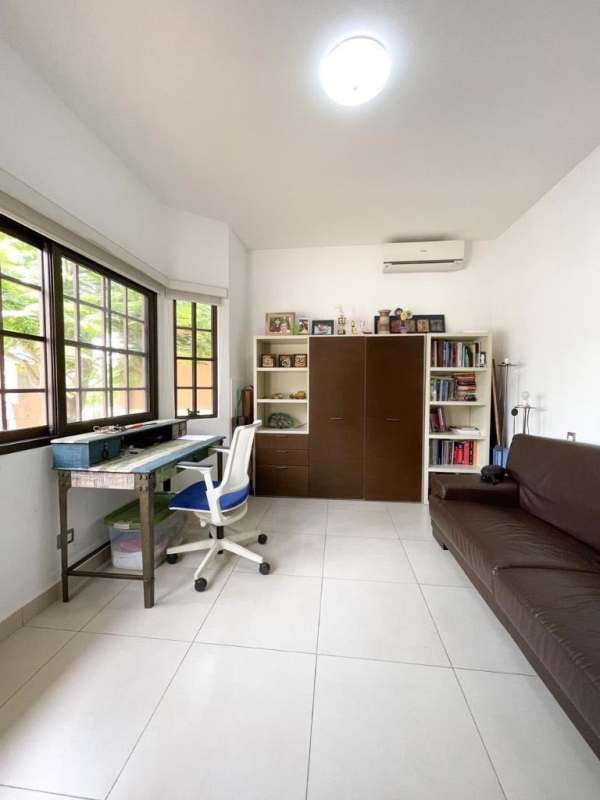 Bright lounge with sectional sofa, marble floors, open to modern kitchen at PH Sunset Coast Costa Sur Panama