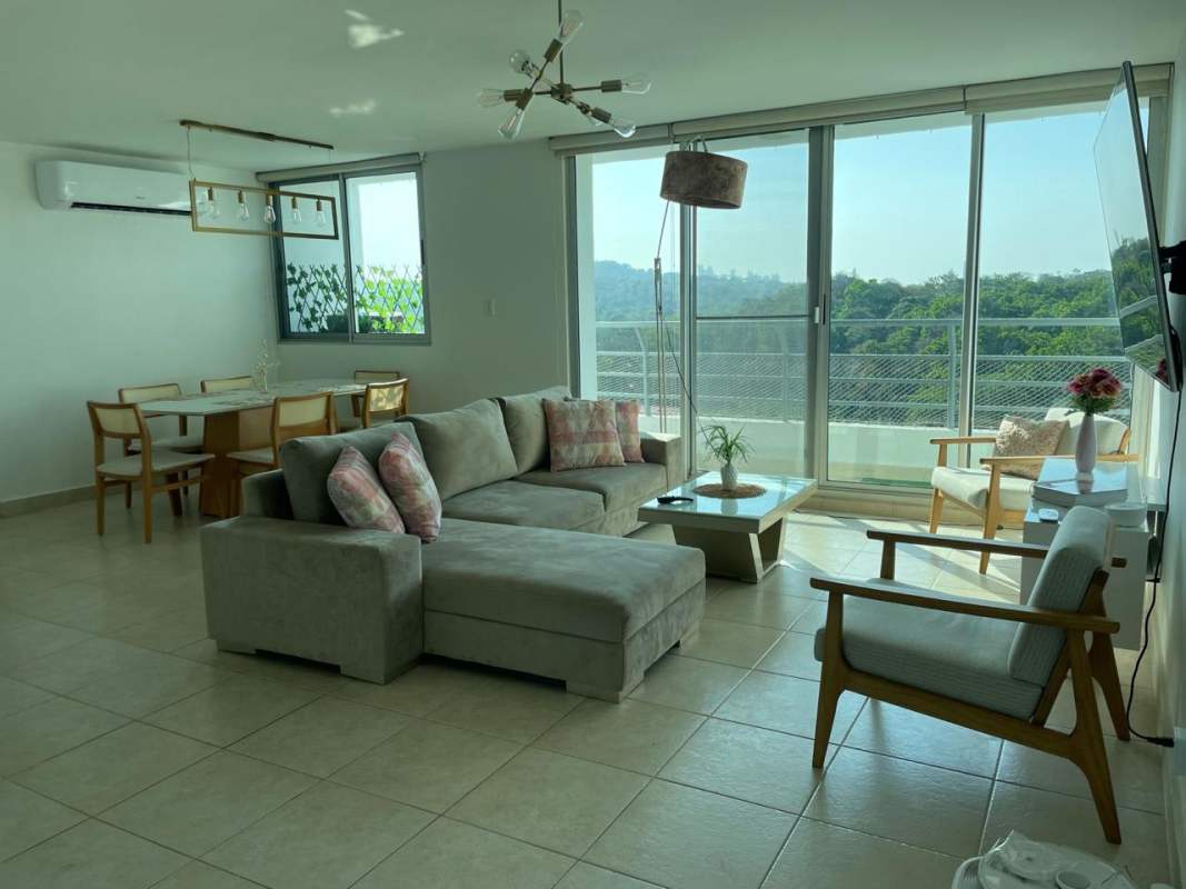 Children’s outdoor playground surrounded by green gardens in Parklane Clayton residential complex Panama