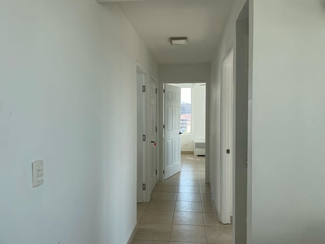 Large outdoor swimming pool with sun loungers surrounded by trees Parklane Clayton Panama