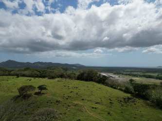 Mountainous terrain with lush greenery and distant ocean views in Cerro Campana Panama