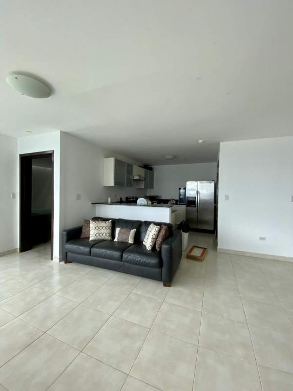 Furnished open concept living room and kitchen in PH Riverside Costa del Este Panama