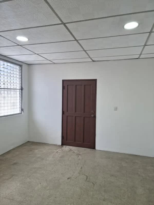 Entry area of rental office in Edificio Triana Calidonia Panama City with louvered window