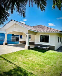 Front facade single story house with carport and large window at Urbanización Belén Bugaba