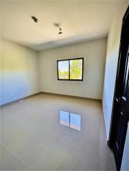 Bright bedroom with tiled porcelain floor window natural light in Bugaba house