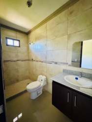 Stylish bathroom with porcelain tiles and granite vanity in house for sale Bugaba Panama