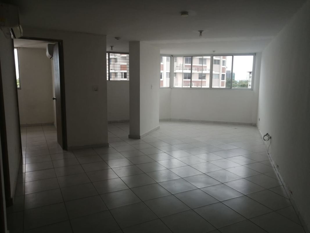 Living room with white tiled floor, split AC, bright open layout in PH Llano Bonito Panama City