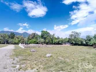 Fenced gentle slope land with greenery and mountain background Boquete Panama