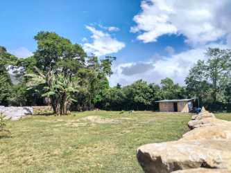 Scenic open grass field with panoramic mountain backdrop Boquete Panama land