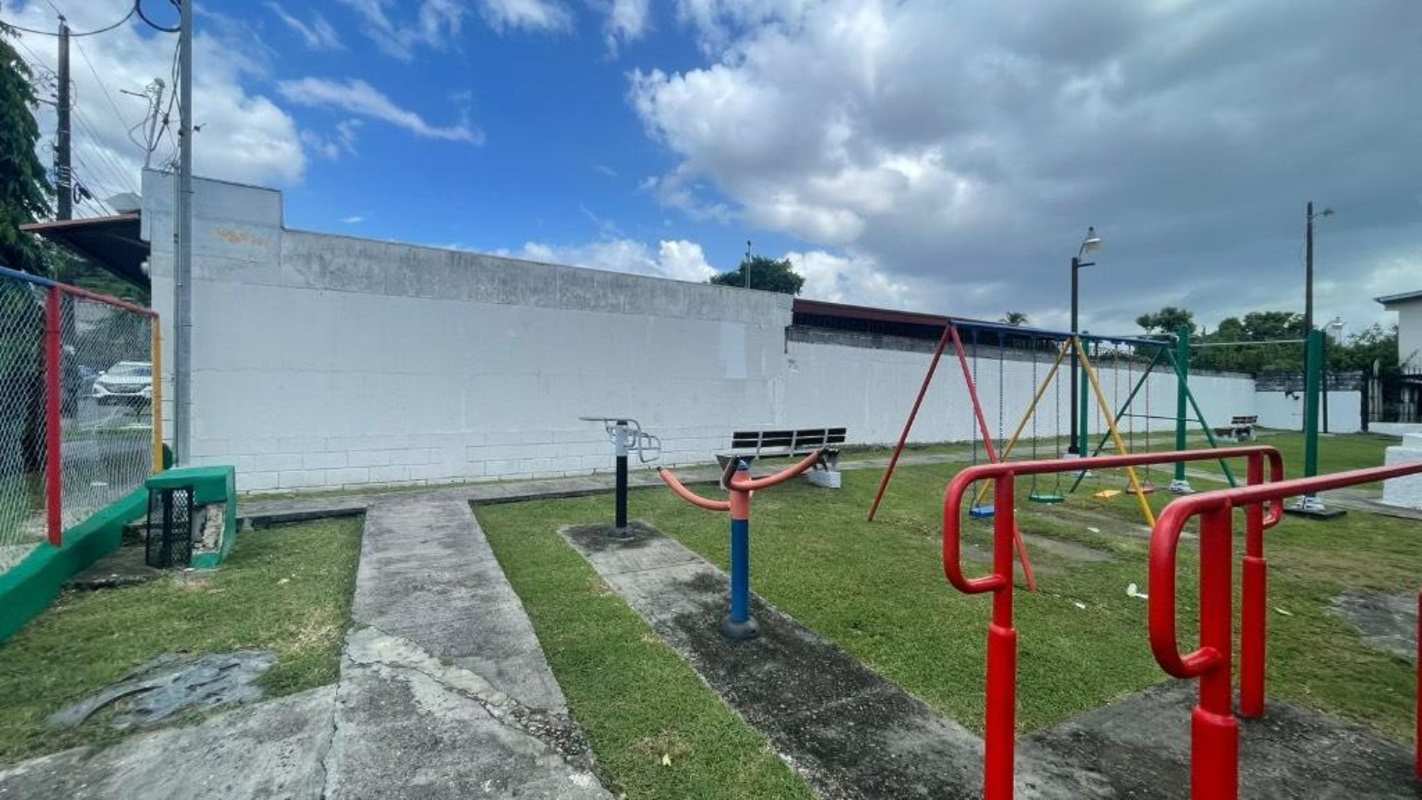 Single-story house with secure garage and metal bars, suburban Panama Monte Oscuro location