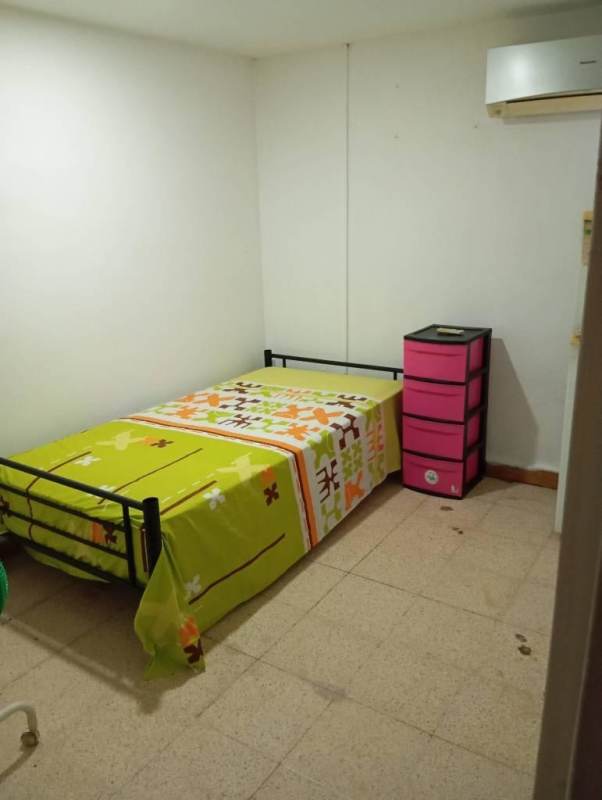 Simple furnished bedroom with fridge, drawers, AC in San Miguelito Panama City