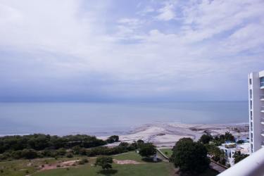 Modern living room with blue sofa and ocean views Playa Blanca