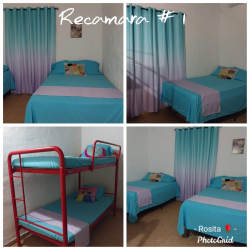 Living room with seating, decor and bright windows at beach villa in Nueva Gorgona