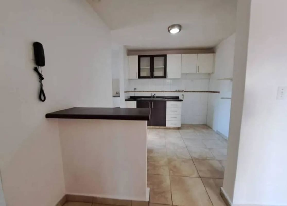 Bedroom with built-in closet, ceiling fan and tile floor in Villa Lucre Apartment Panama
