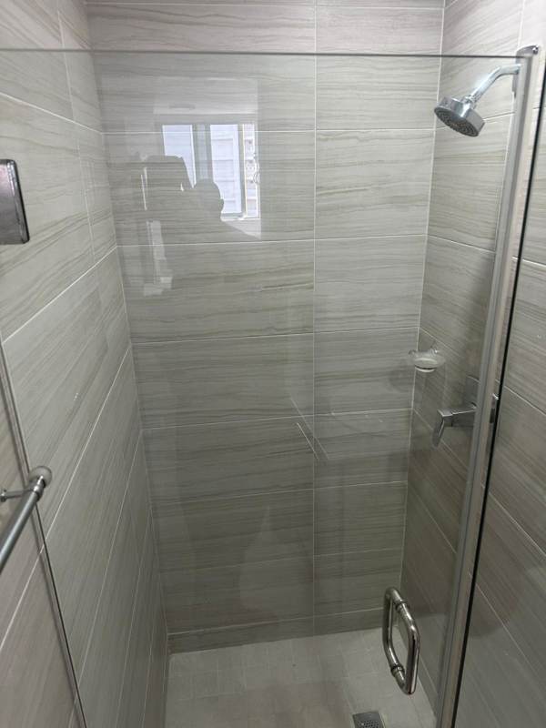 Bathroom with glass enclosed shower in PH Obarrio Tower Panama City apartment for sale