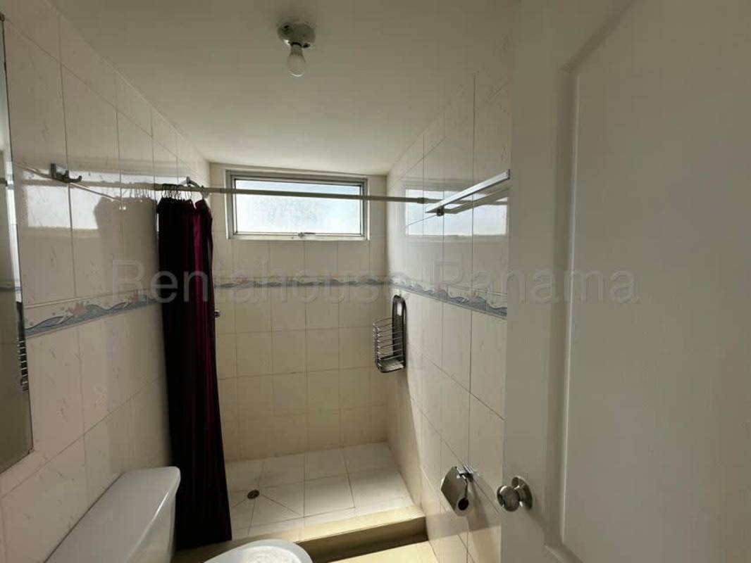 Open kitchen with granite countertop and modern cabinets PH Lefevre Tower Panama