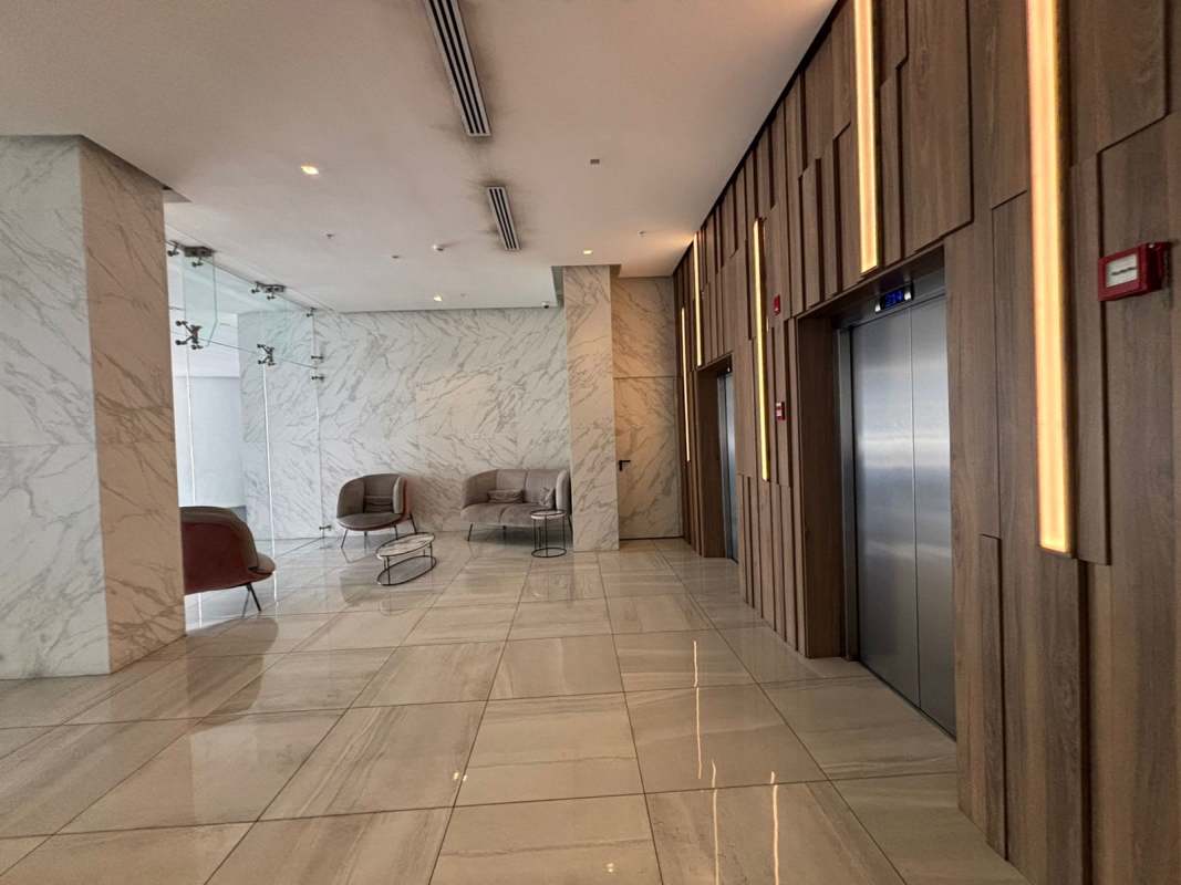 Modern lobby with marble finishes and comfortable seating PH Altamira Panama City