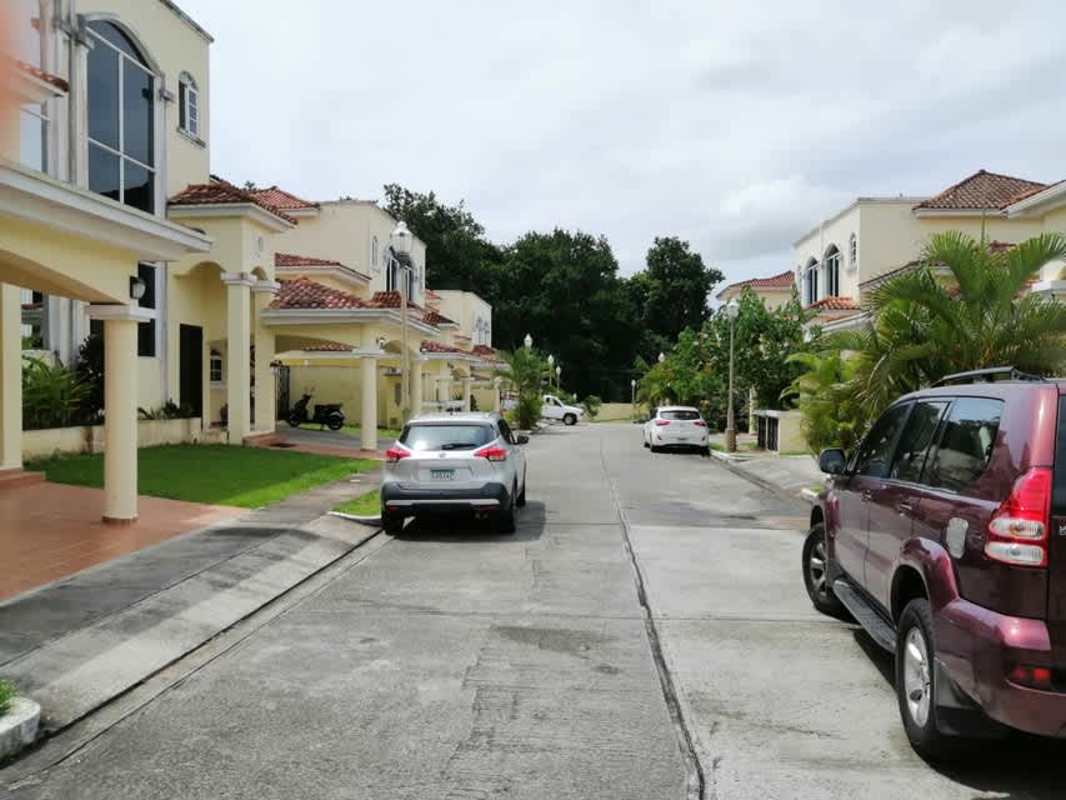 Covered tiled patio opens to garden, accessible from living spaces in Clayton Village rental house