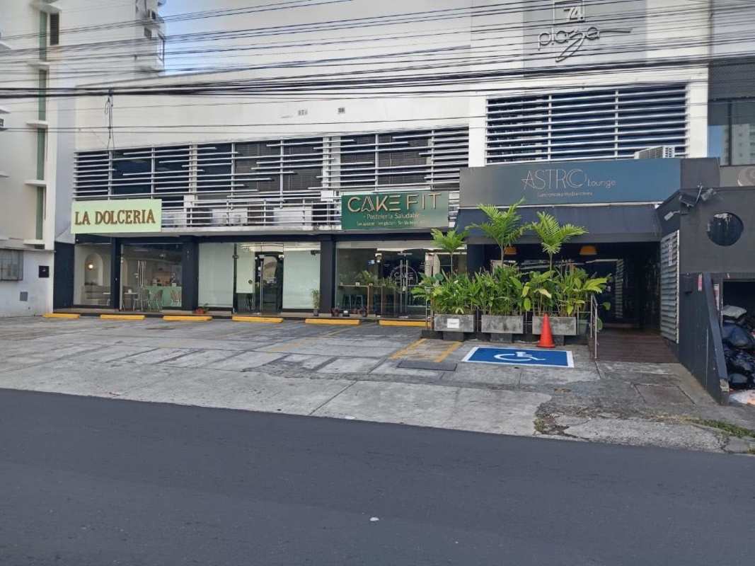 Retail spaces with glass facades, parking and planters in vibrant San Francisco commercial hub Panama City