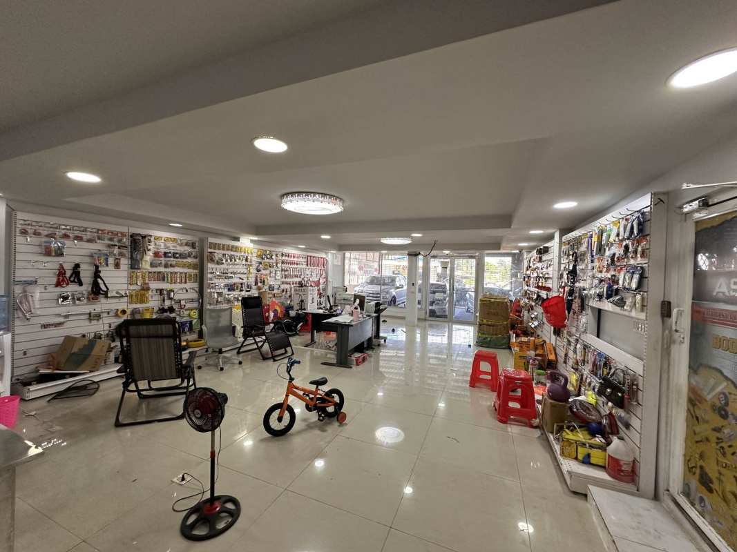 Interior retail showroom open space glass doors tile floor Monte Oscuro commercial building Panama