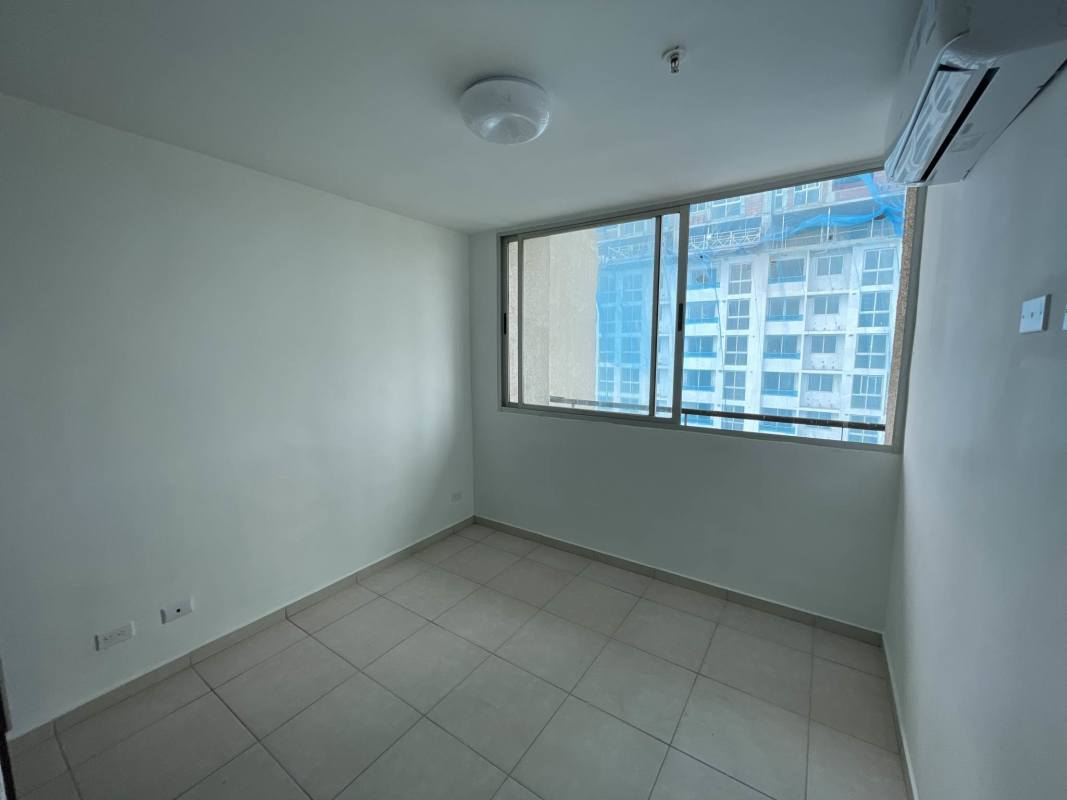 Second bedroom with large window and ceramic flooring in PH Alsacia Panama City