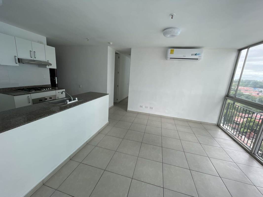 Modern apartment open plan kitchen and living area with granite and large windows in PH Alsacia Panama
