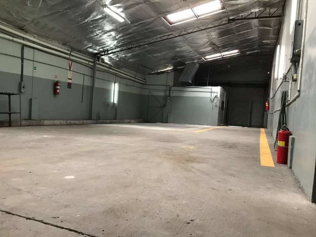 Spacious garage area inside commercial warehouse with parking markings Panama City