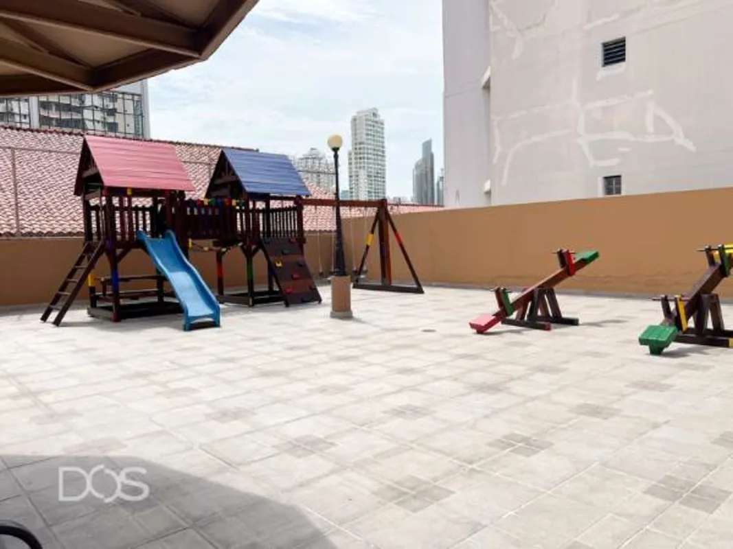 Outdoor children's playground with slides, swings at PH Marbella Tower Panama City