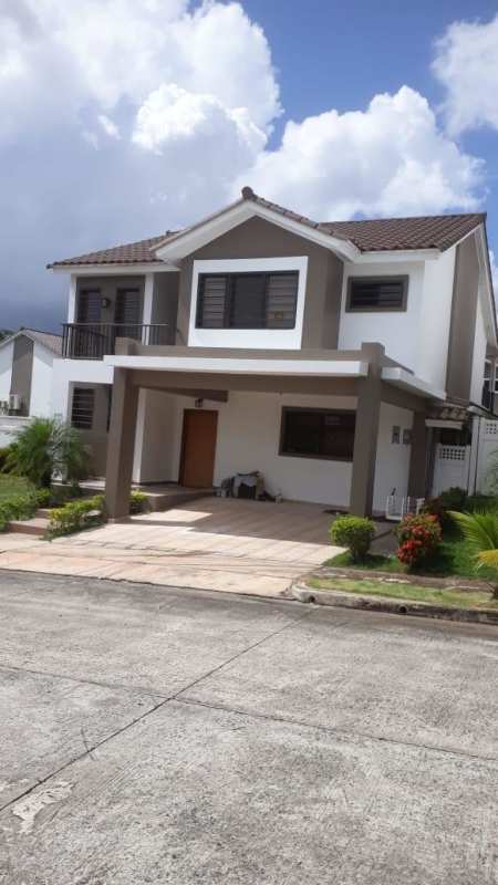 Spacious modern house exterior with balconies and garden in Panama